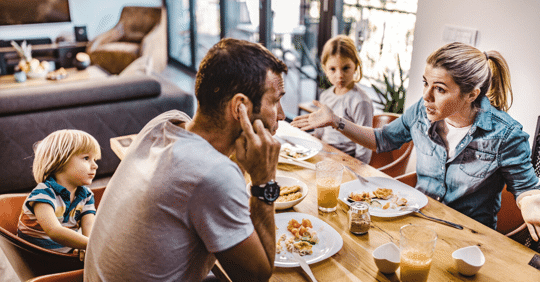 couple fighting at dinner table